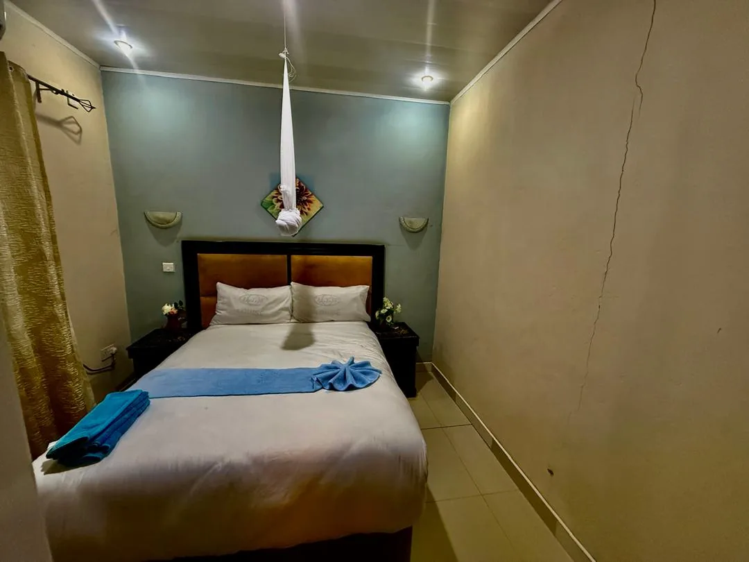 Royal Olympia Lodges & Safaris premium chalet bedroom